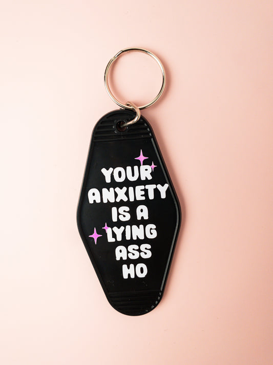 your anxiety is a lying ass ho motel keychain