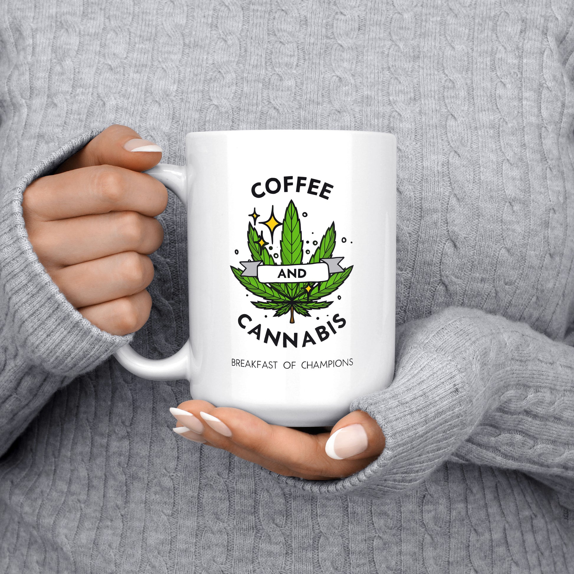 Coffee and Cannabis written on a white ceramic mug with a green marijuana leaf held in hands