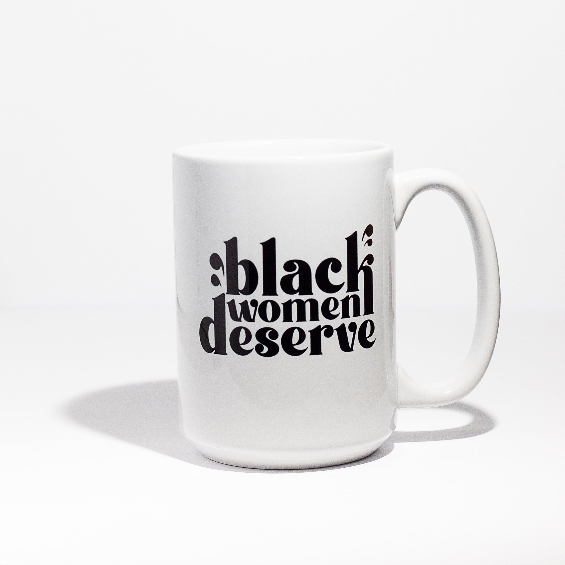 15oz white ceramic coffee mug with Black Women Deserve written in black letters