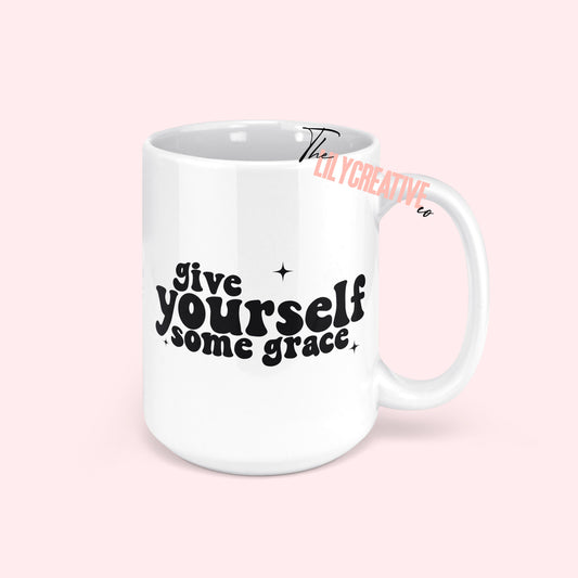 70s inspired "Give yourself some grace" written in black letters on a white 15oz ceramic coffee mug