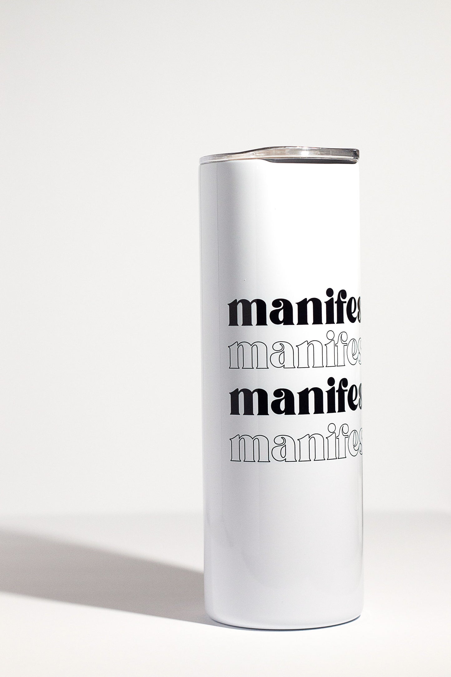 20oz double insulated tumbler with manifest it written on it